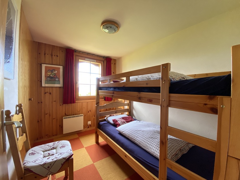 children's room with bunk beds and built-in wardrobes